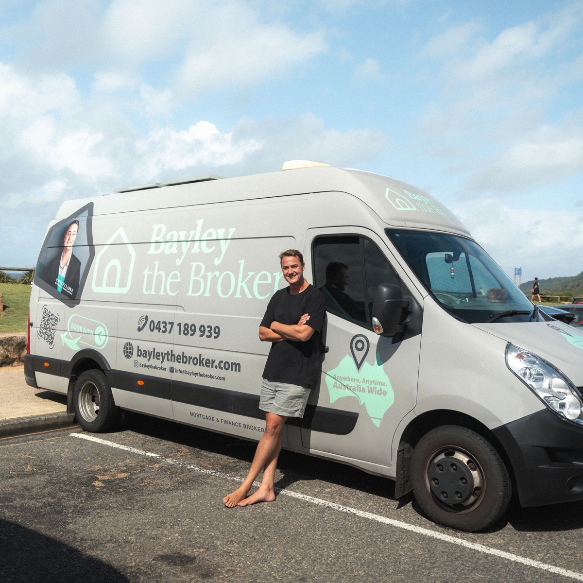 Bayley Clarke with the Bayley the Broker van